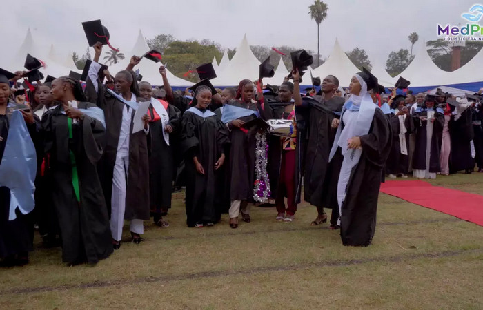 Female student reviewing notes in a hospital setting