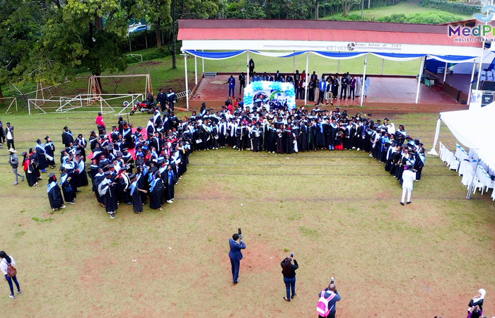 Male student talking with an instructor