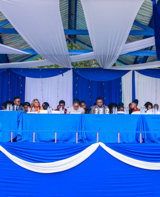 Two men in professional attire giving each other a high five