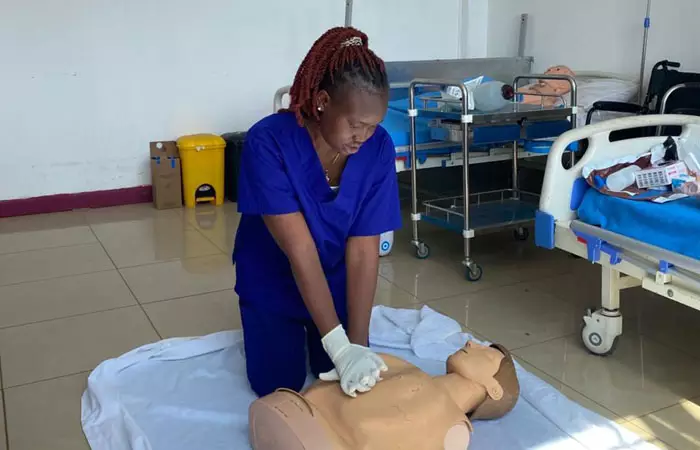 A group of medical students in a classroom setting.